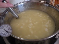Stir and heat the curds